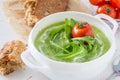 Arugula and tomatoes puree soup in white bowl Royalty Free Stock Photo