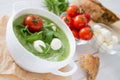 Arugula and tomatoes puree soup in white bowl Royalty Free Stock Photo