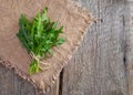 Arugula on wood and cloth. Royalty Free Stock Photo
