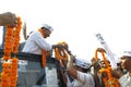 Arvind Kejriwal being garlanded.