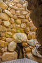 Arzachena, Sardinia, Italy - Archeological ruins of Nuragic complex La Prisgiona - Nuraghe La Prisgiona - with interior of stone