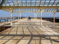 Tourists Walking Along Dun Laoghaire Pier in Ireland