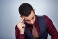 As a businessman a headache cannot stop me. Studio shot of a handsome young businessman experiencing a headache against