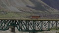 Cars passing by the Darcha Bridge the Longest Bridge in Himachal