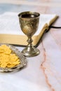 As a Christian, Holy Communion is celebrated with unleavened bread, wine in a chalice, and other symbols of Jesus Christ Royalty Free Stock Photo