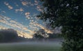 Dawn's Whisper: Mist and Sunrise in the Countryside