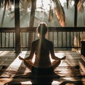 Seated meditation silhouette amidst tropical sunrise ambience