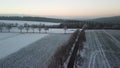 As the drone ascends into the crisp winter air, a breathtaking panorama unfolds below