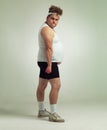 This is as easy as 1, 2, 3. Portrait of a overweight man exercising with dumbbells. Royalty Free Stock Photo