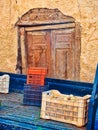 Plastic Crate of Potatoes on Blue Truck With Old Stucco Building, Greece