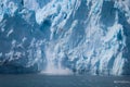 Closeup view of a tidewater glacier calving