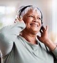 As this life gets colder, keep celebrating your own warmth. a beautiful senior woman listening to music while sitting on