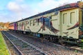 As, Limburg, Belgium. December 17, 2023. Disused train tracks of old station with old passenger carriages Royalty Free Stock Photo