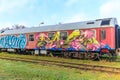 As, Limburg, Belgium. December 17, 2023. Disused train tracks of old station with very old red sheet passenger car Royalty Free Stock Photo