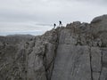 As they navigated the treacherous terrain of the high rocks, the mountaineers unleashed their boundless energy, bouncing and Royalty Free Stock Photo