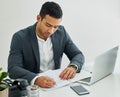 As for now Ive a different weapon. a businessman doing paperwork at his desk in a modern office. Royalty Free Stock Photo
