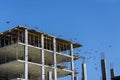 As part of the construction of a multi-story apartment building, work is in progress along the building's perimeter Royalty Free Stock Photo