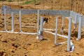 As part of the construction process, under the foundation of the new home, utility sewer pipes and water pipes must be Royalty Free Stock Photo