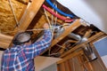 As part of the reconstruction of the home, the HVAC vent pipes and heating system were installed in the ceiling and Royalty Free Stock Photo