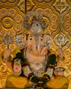 Closeup view of decorated and garlanded Isolated idol of Hindu God Ganesha in Pune ,Maharashtra, India.