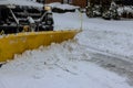 As result of heavy snowstorm, snowplow trucks remove a large amount of snow from residential areas