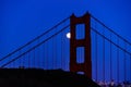 Full moon rising alongside the Golden Gate bridge in June of 2022 Royalty Free Stock Photo