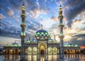 Stunning Architectural Detail of a Mosque at Twilight Illuminated Minarets and Glowing Domes Capture the Serene Beauty Royalty Free Stock Photo