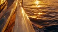 As the sun sets behind the horizon the golden hour casts a warm glow on the glossy deck of a yacht. The reflections on Royalty Free Stock Photo