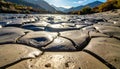 Golden Light on a Cracked and Drying Riverbed Royalty Free Stock Photo