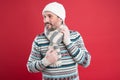 As temperatures drop outside. Unshaven man with winter look. Mature man in winter style design. Warm knitwear for cold Royalty Free Stock Photo