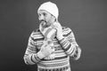 As temperatures drop outside. Unshaven man with winter look. Mature man in winter style design. Warm knitwear for cold