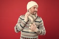 As temperatures drop outside. Unshaven man with winter look. Mature man in winter style design. Warm knitwear for cold