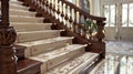 As you descend the sweeping staircase the mahogany handrail is accented by a border of luxurious Victorian Grandeur