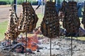 An asado is a roast of several other meats, which are cooked on a typical barbecue with vertical grills.