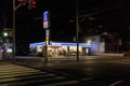Asagiri, Japan - April 28, 2022: Lawson's convenience store with no customers on quiet intersection at night
