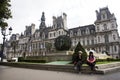 Asain women mother and daughter travel and posing for take photo with Hotel de Ville