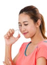 Asain Young Woman Using Eyelash Curler.