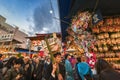 Crowds buying and holding auspicious rakes about society themes named sesÃÂ kumade at Tori-no-Ichi Fair.