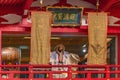 Japanese dancer in kimono dancing with an eagle mask in Ootori shrine during the Tori-no-Ichi fair. Royalty Free Stock Photo