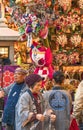 Merchants wearing happi coat and plushes of the mascot of Tokyo 2020 Summer Olympics.