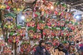 Merchants in front of a bunch of auspicious rakes in the Ootori shrine during the Tori-no-Ichi Fair.