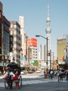 Asakusa, Tokyo, Japan - A rickshaw for tourists and Tokyo Skytree.