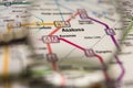 Asakusa Tokyo metro station on a printed metro map under a magnifier lens Royalty Free Stock Photo