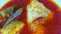 Asam Pedas Melaka, the signature dish of Malacca State of Malaysia. A home made hot and sour curry served with fish and vegetable Royalty Free Stock Photo
