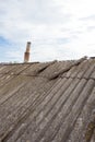 Asbestos old dangerous roof tiles. Royalty Free Stock Photo