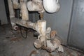 Asbestos pipe insulation in a mechanical room