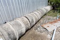 Asbestos pipe pile on the ground  in the construction area Royalty Free Stock Photo