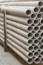 asbestos pipes in a stack in a warehouse or in a building store. Pallets with sewer pipes Royalty Free Stock Photo