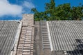 Asbestos removal. Old and very dangerous asbestos roof. Royalty Free Stock Photo
