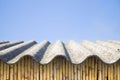 Asbestos roof above a wattle wall - image with copy space